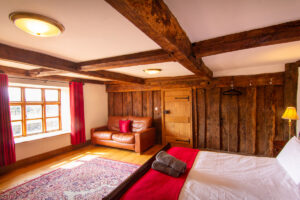 Bedroom: “Inviting bedroom at Colstey Farmhouse with a plush bed, soft lighting, and serene ambiance for a restful stay.”